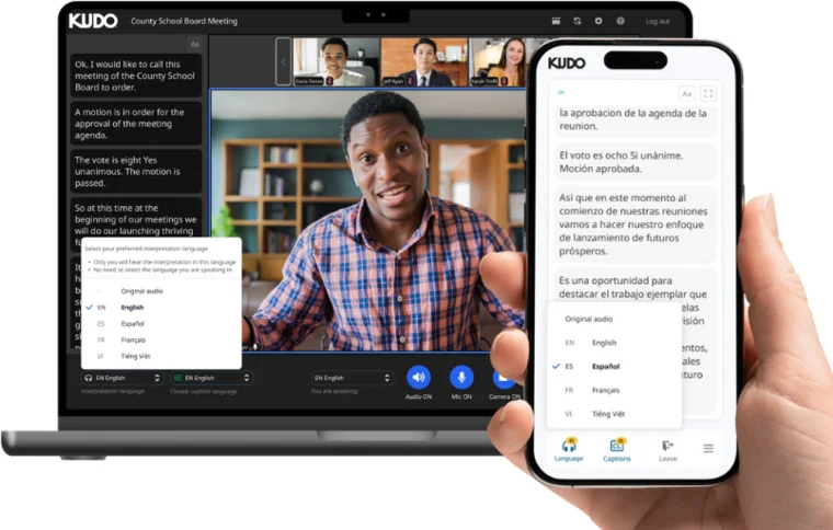 KUDOの会議画面。ノートPCに登壇者の映像と英語の字幕、通訳言語の選択リスト（Original audio・English・Español・Français・Tiếng Việt）が表示され、手前のスマートフォンにはスペイン語の字幕が表示されている