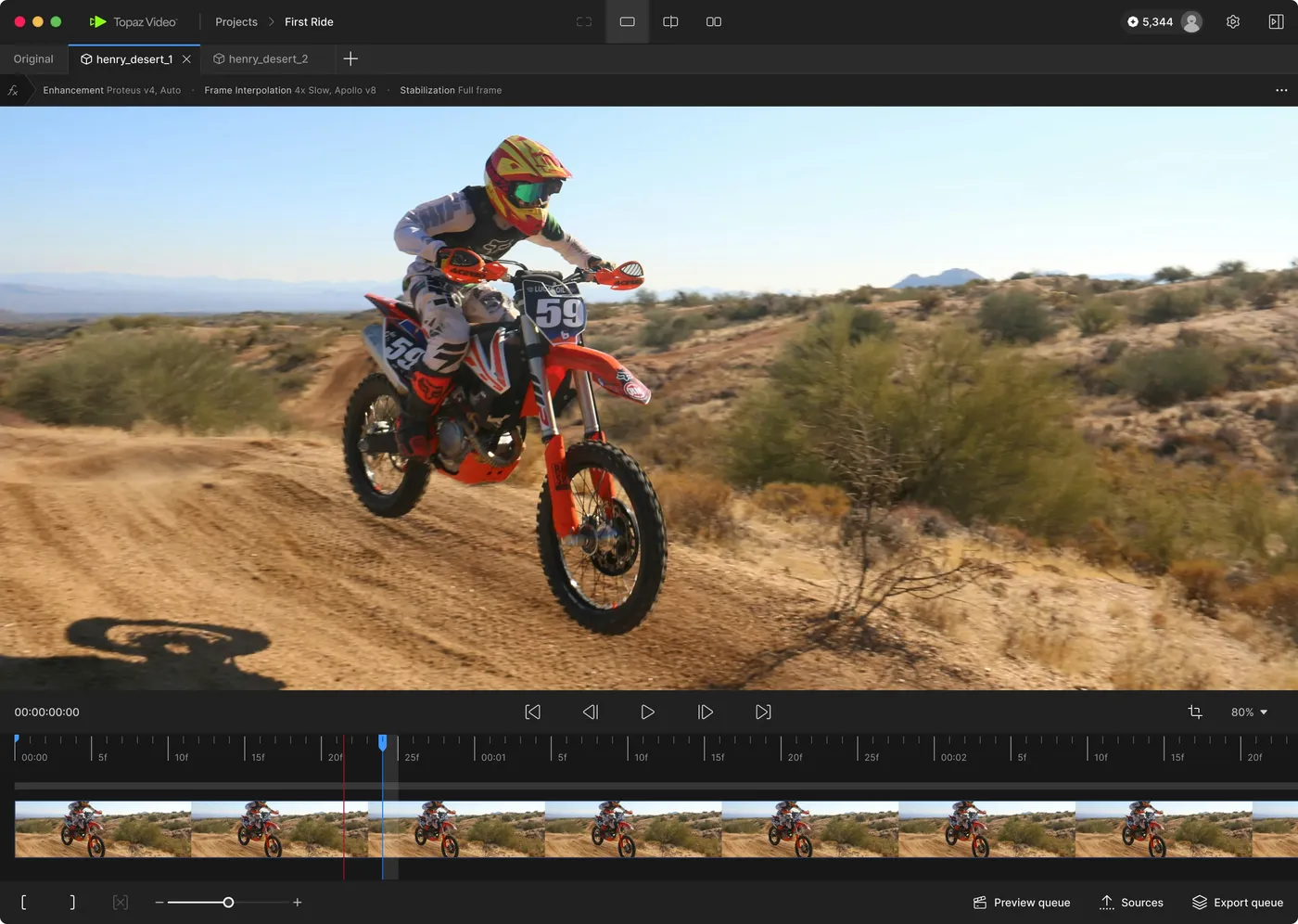 The Topaz Video editing screen. A motocross clip has Enhancement (Proteus v4), Frame Interpolation (4x Slow, Apollo v8) and Stabilization applied, with a timeline and preview and export queues at the bottom